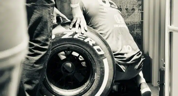 a person holding a tire